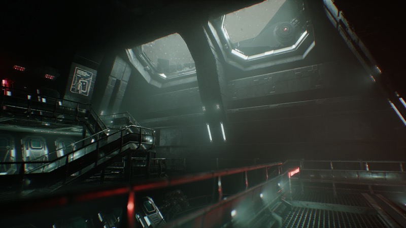 Docking ring corridor lit by failing emergency lights