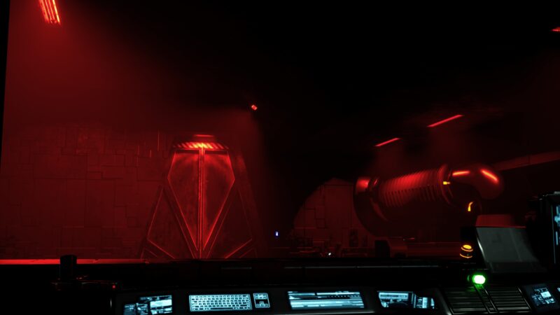 Sealed blast door under red alert lighting, seen past a control console