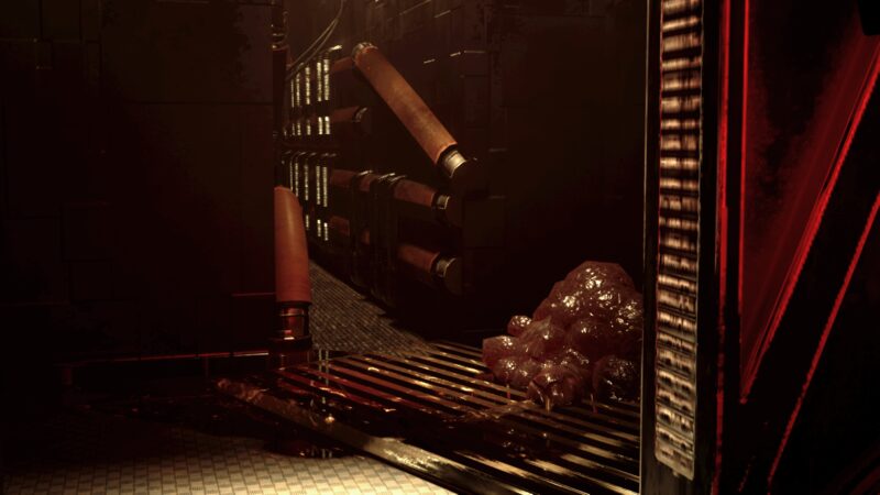 Growth spreading across floor grating beside coolant pipes
