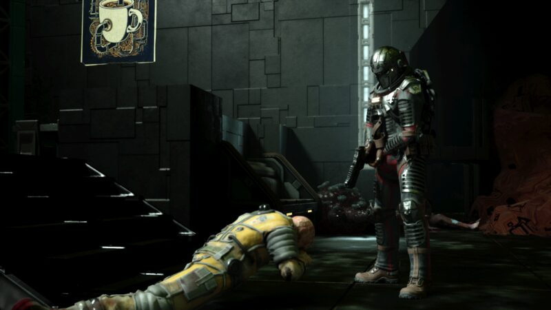 Colton looking down at a crewman's body in a yellow work suit